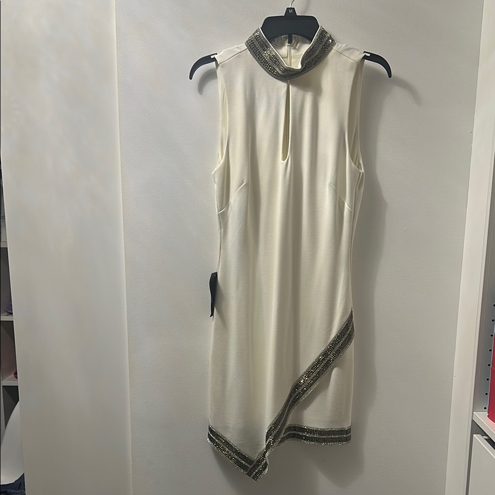 Elegant Cream Sleeveless Dress with Black Accents